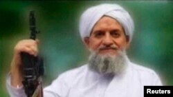 FILE - U.S. counterterrorism officials say there's no reason to believe an audio message released by al-Qaida's Ayman al-Zawahiri, seen in an image from a video released in 2011, is "not authentic."