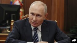 Rais wa Russia Vladmir Putin akiwa katika mkutano Kremlin Moscow. AP.