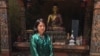 Museum guide Tashi Pelden counts herself among the fortunate few young people who have landed a job. (A. Pasricha/VOA)