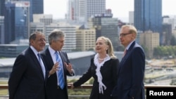 Australia's Foreign Minister Bob Carr (R) and Australian Defense Minister Stephen Smith (2nd L) talk with U.S. Secretary of State Hillary Clinton (2nd R) and U.S. Defense Secretary Leon Panetta (L) in Perth, November 14, 2012. 