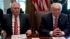 President Donald Trump, accompanied by Secretary of State Rex Tillerson, White House Senior Adviser Steve Bannon, left, and National Security Adviser H.R. McMaster, right, participates in a Cabinet meeting, June 12, 2017, in the Cabinet Room of the White 