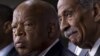 Rep. John Lewis, D-Ga., left, and Rep. John Conyers, D-Mich., right, express disappointment in the Supreme Court's decision that invalidates Section 4 of the Voting Rights Act, June 25, 2013, on Capitol Hill in Washington.