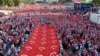 Thousands of demonstrators carry Turkey's national flags during a march protesting recent Kurdish militant attacks on Turkish security forces, in Ankara, Turkey, Sept. 17, 2015. 