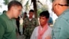 Former Khmer Rouge guerilla Mao Run, center, speaks to Robert L. Jones, left, deputy assistant of Defense for POW/MIA on the island of Koh Tang, Cambodia, Jan 28, 2000. Mao Run was part of the Khmer Rouge unit who fought with U.S. Marines on May 15, 1975. (AP Photo/Heng Sinith)