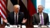 FILE - With U.S. Secretary of Defense James Mattis at his side, U.S. President Donald Trump speaks during a meeting at the White House in Washington, April 3, 2018.