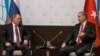 FILE - Russian President Vladimir Putin (L) and Turkish President Recep Tayyip Erdogan are seen talking on the sidelines of a G-20 Summit in Antalya,Turkey, Nov. 16, 2015.