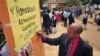 Ugandan anti-gay activist Pastor Martin Ssempa posts public notice offering "rehabilitation" for homosexuals, National Theater, Kampala, Feb. 25, 2014.