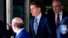 FILE - Former U.S. national security adviser Michael Flynn leaves U.S. District Court, where pleaded guilty of lying to the FBI about his contacts with Russia's ambassador to the United States, in Washington, Dec. 1, 2017.