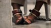 FILE - A detainee's feet are seen shackled to the floor inside the Camp 6 high-security detention facility at Guantanamo Bay U.S. Naval Base April 27, 2010.