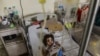 Indian patient, Aishwarya Gupta (4) lies on a bed in the dengue ward of a government hospital in New Delhi," Sept. 15, 2015. 