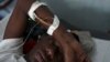 Givenchi Predelus suffers from Cholera at the Cholera Treatment Center run by the Haitian Ministry of Public Health and Population in collaboration with Doctors Without Borders, Port-au-Prince, Haiti, April 13, 2015.