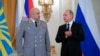 FILE - Russian President Vladimir Putin, right, applauds Col. Gen. Sergei Surovikin during an awards ceremony for troops who fought in Syria, in the Kremlin, in Moscow, Dec. 28, 2017. Putin says Russia's action in Syria has demonstrated the power of the n