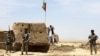 Afghan Border Police personnel keep watch during an ongoing battle between Pakistani and Afghan Border forces near the Durand line at Spin Boldak, in southern Kandahar province, May 5, 2017.