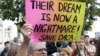 Judy Weatherly, a supporter of the Deferred Action for Childhood Arrivals (DACA), holds up a sign during a protest outside of the Federal Building in San Francisco, Sept. 5, 2017.