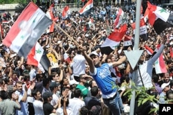 Des partisans du président Assad à Damas