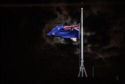 FILE - The New Zealand national flag is flown at half-staff on a Parliament building in Wellington on March 15, 2019, after attacks on two Christchurch mosques left more than 50 dead on March 15.