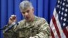 FILE - Col. Steve Warren, the new spokesman for the U.S.-led coalition in Iraq, speaks to reporters during a news conference at the U.S. Embassy in the heavily fortified Green Zone in Baghdad, Iraq.