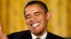U.S. President Barack Obama smiles after making remarks on regulatory reform in the East Room at the White House in Washington October 9, 2009.