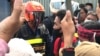 Muong Sopheak, a representative for the protesters, confronts a guard near the Freedom Park in Phnom Penh, Cambodia, September 7, 2020. (Hul Reaksmey/VOA Khmer) 
