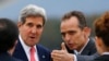 Geneva head of protocol Jean-Luc Chopard (R) welcomes U.S. Secretary of State John Kerry as his arrival at Geneva International airport, Nov. 8, 2013.