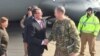 FILE - U.S. Defense Secretary Ash Carter greets Army Lt. Gen. Sean MacFarland after arriving in Baghdad, Dec. 16, 2015. 