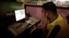 FIEL - A man explores social media on a computer at an internet club in Islamabad, Pakistan, August 11, 2016.