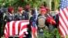 FILE - An honor guard carries the coffin of U.S. Army Sergeant La David Johnson, who was among four special forces soldiers killed in Niger, at a graveside service in Hollywood, Florida, Oct. 21, 2017. 