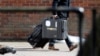 FILE - An inspector from the Organization for the Prohibition of Chemical Weapons (OPCW) arrives to begin work at the scene of the nerve agent attack on former Russian spy Sergei Skripal, in Salisbury, Britain, March 21, 2018. An OPCW team will begin collecting samples April 14, 2018, at the site of an alleged chemical weapons attack in Douma, Syria.