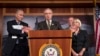 Senate Majority Leader Harry Reid, center, accompanied by Democratic leaders, gestures during a news conference on Capitol Hill in Washington, Friday, Oct. 4, 2013.