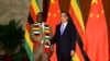 FILE - Zimbabwean President Emmerson Mnangagwa shakes hands with Chinese Premier Li Keqiang before their meeting at the Great Hall of the People in Beijing, China, April 4, 2018. 