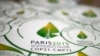 FILE - Stickers with emblem of Climate Change Conference 2015, slated to kick off Nov. 30 in Paris.