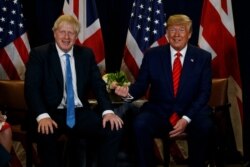 FILE - President Donald Trump meets with British Prime Minister Boris Johnson at the United Nations General Assembly, Sept. 24, 2019, in New York.