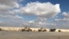 Kendaraan militer AS tampak di pangkalan udara Al-Asad di Provinsi Anbar, Irak, 13 Januari 2020. (Foto: John Davison/Reuters)