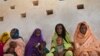 FILE - Mothers wait for their children to be examined for signs of malnutrition at a walk-in nutrition clinic in Barrah, a desert village in the Sahel belt of Chad, April 20, 2012. UNICEF estimates that 127,000 children under five in Chad's Sahel belt wi