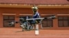 Lonh Vannsith, a fourth-year student of the National Polytechnic Institute of Cambodia, flies his team's drone in Phnom Penh, Cambodia, on September 17, 2021. REUTERS/Cindy Liu