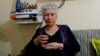 Raja Banout is teaching other Syrian refugee women to overcome pain and disorientation with song. (J. Dettmer/VOA)
