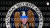 FILE - A tablet computer shows the logo of the United States' National Security Agency (NSA) against the backdrop of code in this multiple-exposure demonstration photo. 