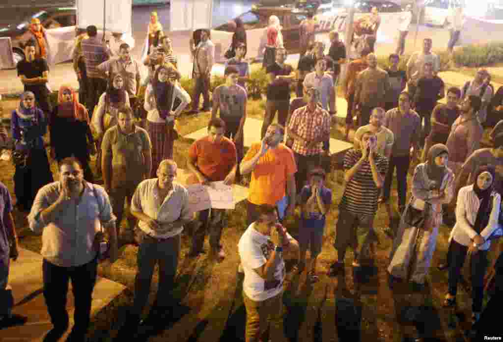 Flares illuminate the gathering of several hundred activists the "Third Square" in Cairo. (Hamada Elrasam for VOA)