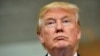 FILE - Republican presidential candidate Donald Trump listens during a news conference after speaking at the TD Convention Center, in Greenville, South Carolina, Aug. 27, 2015. 