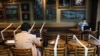 Tables and chairs are taped up to keep social distancing at a Starbucks coffee shop, following the novel coronavirus disease (COVID-19) outbreak, in Hong Kong, China April 2, 2020. REUTERS/Tyrone Siu