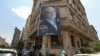 A campaign banner for reformist presidential candidate Masoud Pezeshkian hangs along the facade of a building in Tehran, Iran, on June 26, 2024. Former President Hassan Rouhani endorsed Pezeshkian two days before the election is to take place.