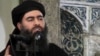 FILE - This image taken from a militant website July 5, 2014, purports to show the leader of the Islamic State group, Abu Bakr al-Baghdadi.