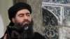 FILE - This image taken from a militant website July 5, 2014, purports to show the leader of the Islamic State group, Abu Bakr al-Baghdadi.
