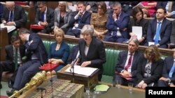 Theresa May, devant la Chambre des communes, dans le centre de Londres, en Grande-Bretagne, le 15 novembre 2018. 