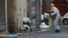 FILE - A police officer enters the building where a raid occurred in Saint-Denis, France, a few days after terrorist attacks in Paris, Nov. 19, 2015. France's prime minister warned at the time that terrorists might at some point use chemical or biological weapons.