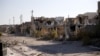 Destroyed buildings are seen in the city of Ramadi, January 16, 2016. Baghdad and Washington have touted Ramadi as the first major success for Iraq's U.S.-backed army since it collapsed in the face of Islamic State's lightning advance across the country's