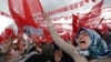Supporters cheer Turkey's President Recep Tayyip Erdogan as he addresses an election rally ahead of Sunday's general election in Golbasi, Ankara, Turkey, June 5, 2015. 