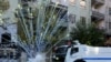 Riot police use water cannon as demonstrators throw fireworks during a protest against the curfew in Sur district, in the Kurdish dominated southeastern city of Diyarbakir, Turkey, December 8, 2015. 