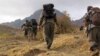 FILE - Rebels of the Kurdistan Workers Party, PKK, in Turkey close to the border with Iraq, May 7, 2013.