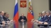 Russian President Vladimir Putin (C) chairs a meeting with members of the Security Council at the Novo-Ogaryovo state residence outside Moscow, Russia, September 29, 2015.